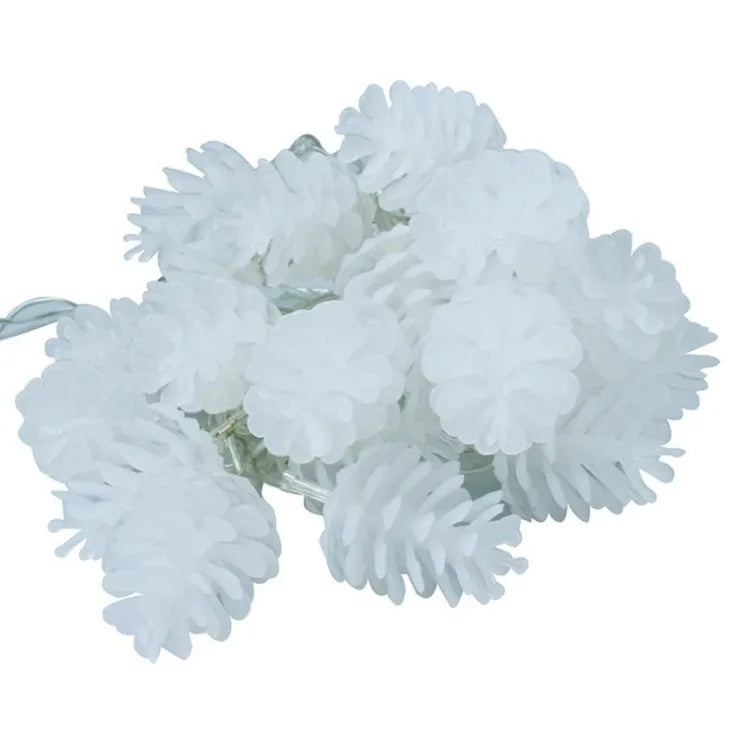 Battery-powered warm white LED pine cone fairy lights draped decoratively on a surface.