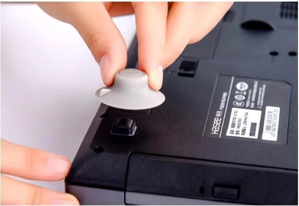 Grey plastic laptop cooling pad stand with 2 large and 2 small risers for better ventilation and viewing angles
