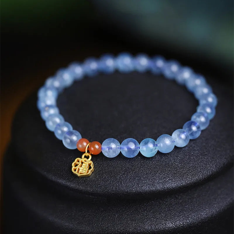 Women's bracelet with 8mm ice translucent aquamarine crystal beads and sequin details