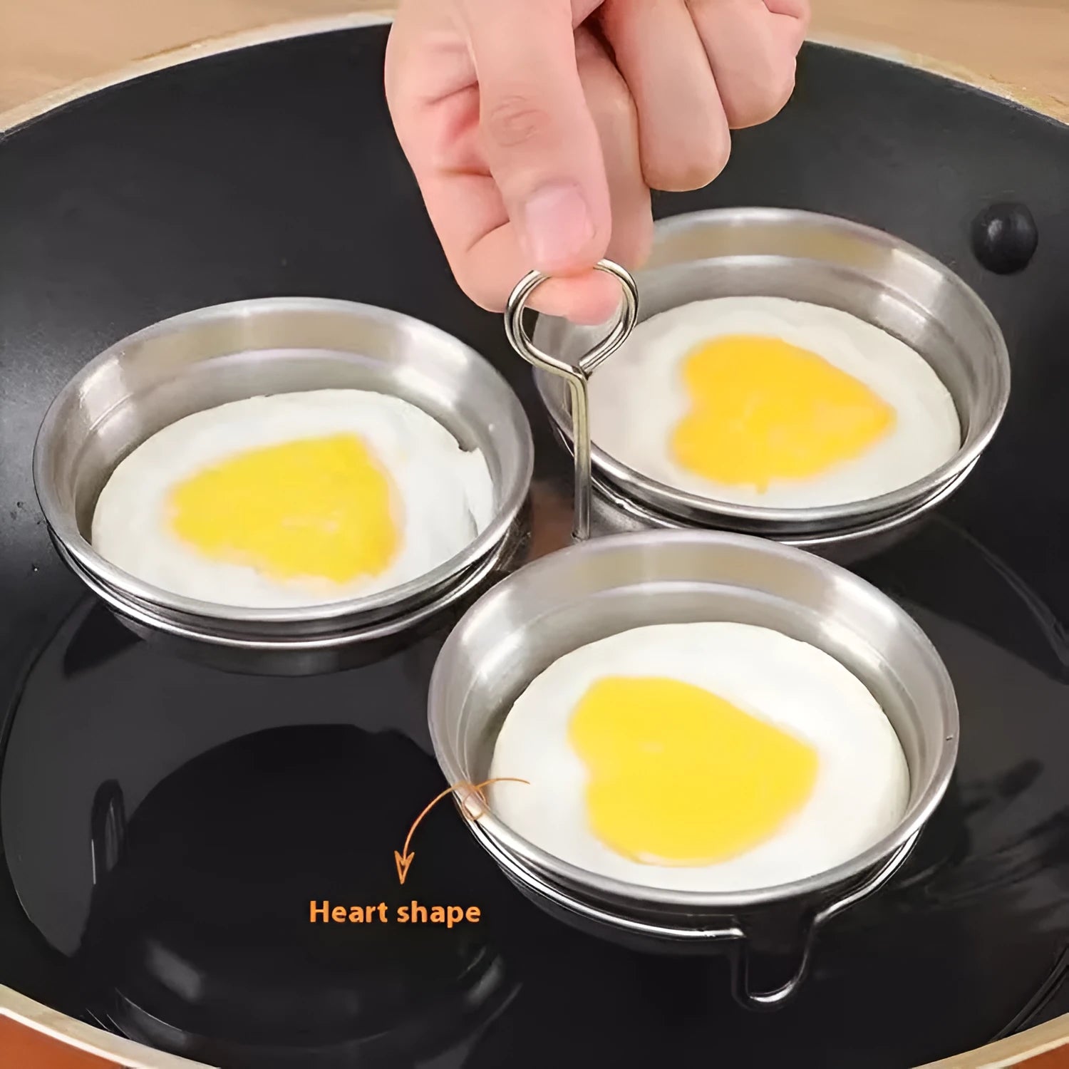 Stainless steel heart-shaped egg steamer with circular mould for household egg preparation