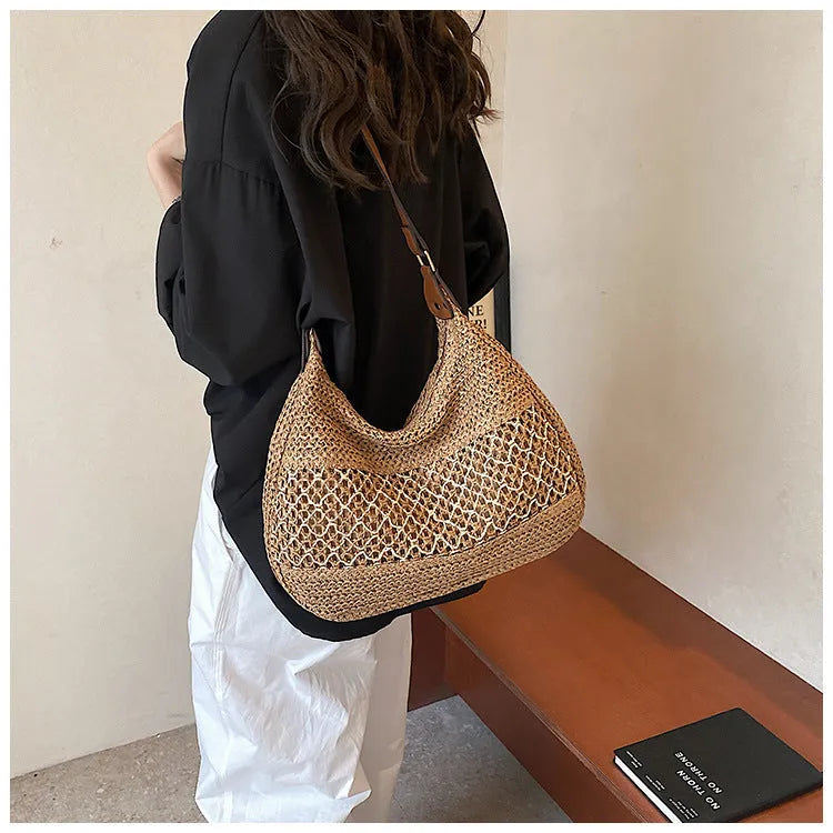 Women's casual straw cross body bag in horizontal square shape with sandwich pocket, shown in khaki colour.