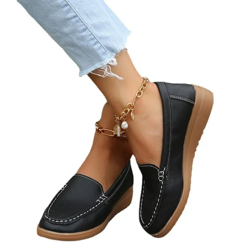 Women's flat slip-on loafers in soft PU leather shown in available colours with round toe and rubber sole