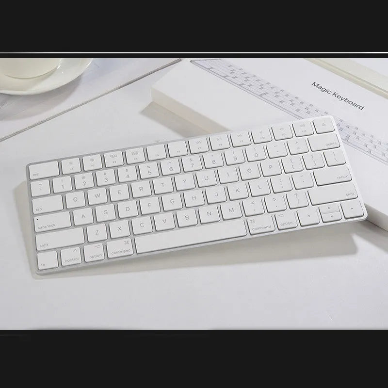 White Apple Bluetooth keyboard with ultra-thin metal design and multimedia function keys