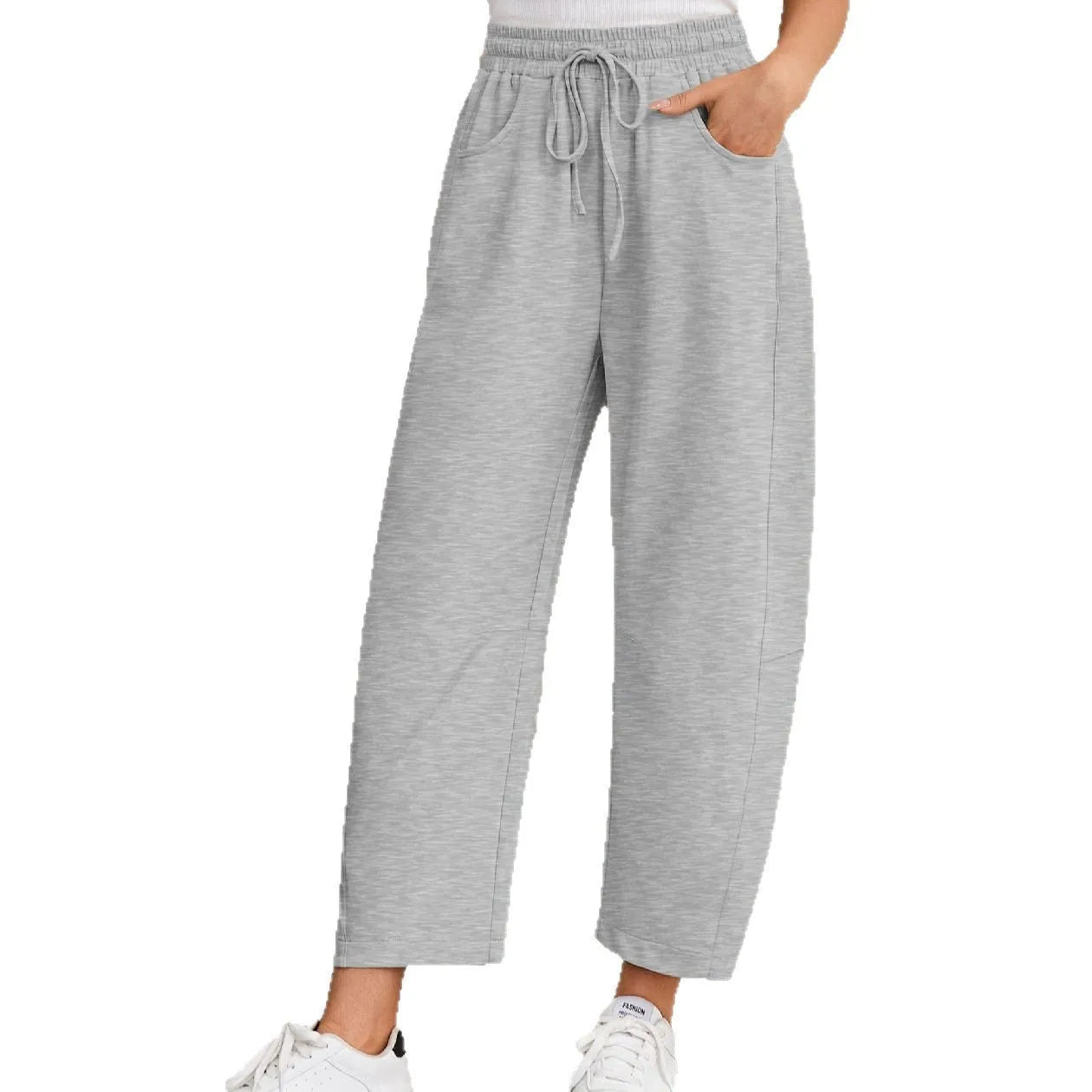 Women's loose cropped sweatpants with elastic waist and drawstring pockets in street fashion style