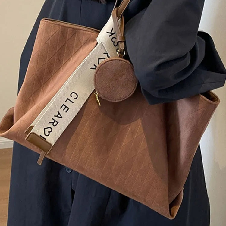Soft green polyester large shoulder tote bag with horizontal square shape and a shoulder strap.
