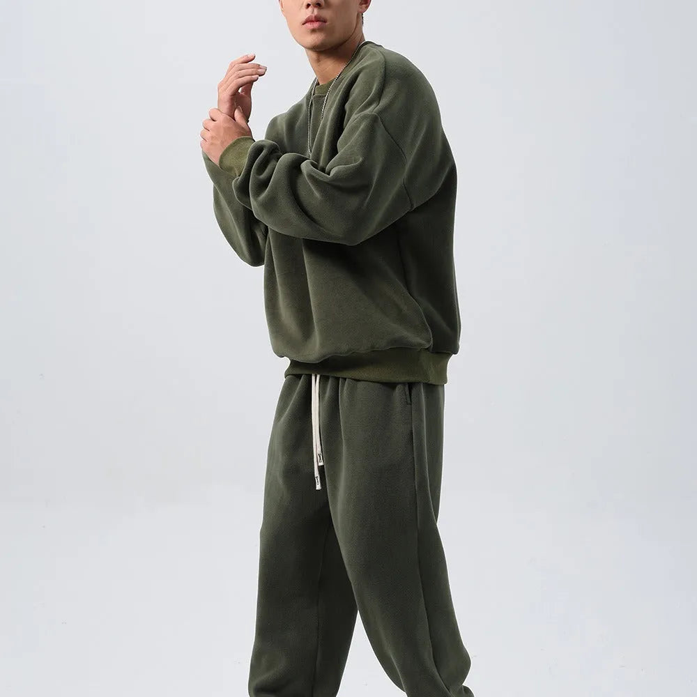 Men's loose fit polar fleece sports suit in army green, showing jacket and trousers.