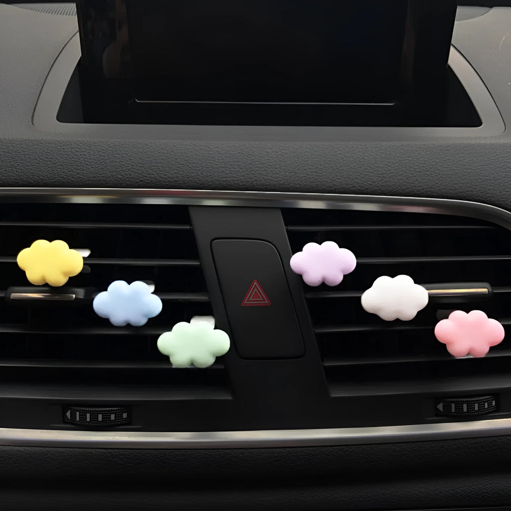 Resin Baiyun cartoon car fragrance clip in multiple colours attached to vehicle air vent measuring 17mm x 27mm