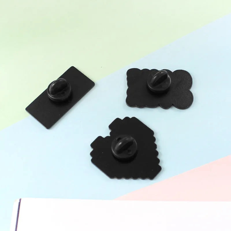 Stereo game console badge made from alloy, shown in one of three colour options with independent OPP packaging.