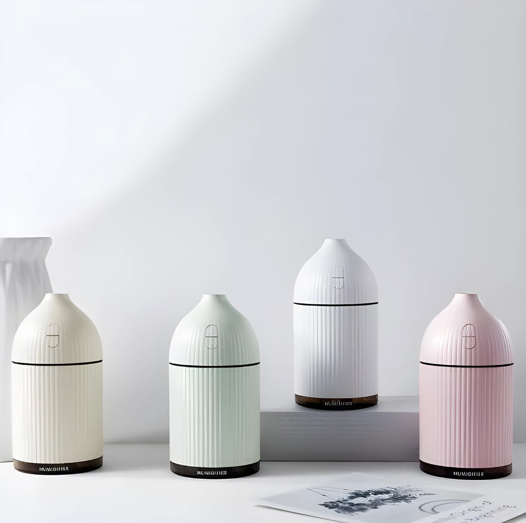 White ultrasonic aromatherapy diffuser with 300ml capacity, USB port, and LED light on wooden surface