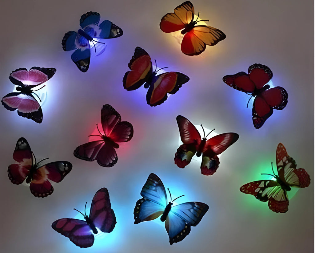 12 butterfly LED night lights with auto-change colours and suction pad on a surface
