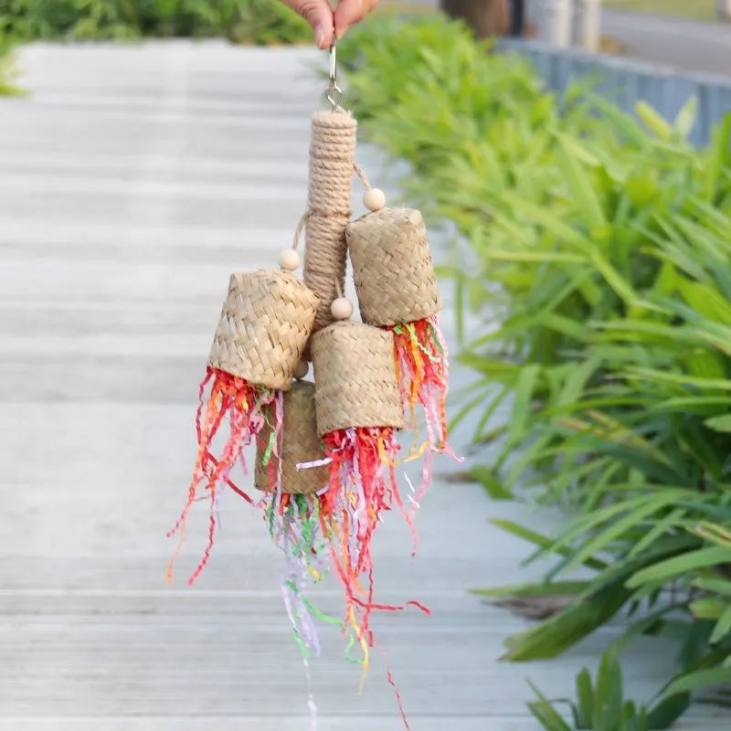 Wood and sisal rope parrot toy with colourful shredded paper strands for foraging.