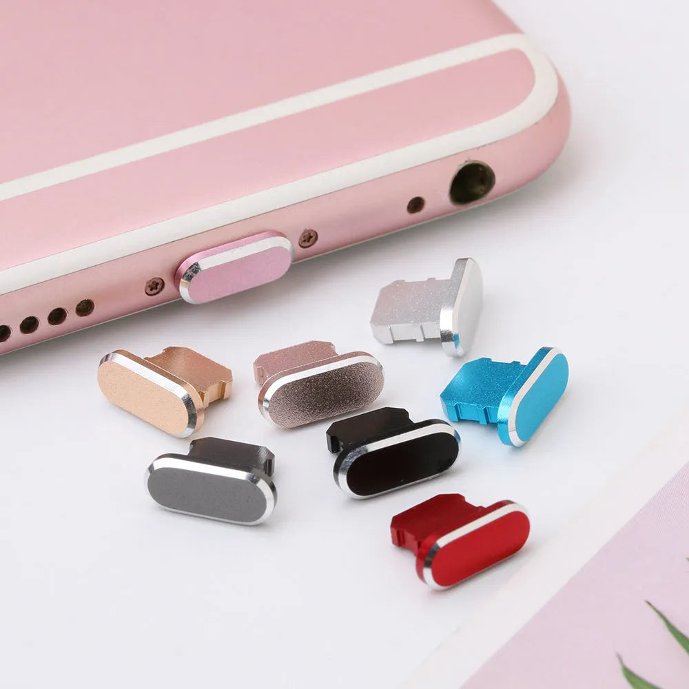 Aluminium alloy dust plug for iPhone charging port in a selection of colours including gold, silver, and rose gold.