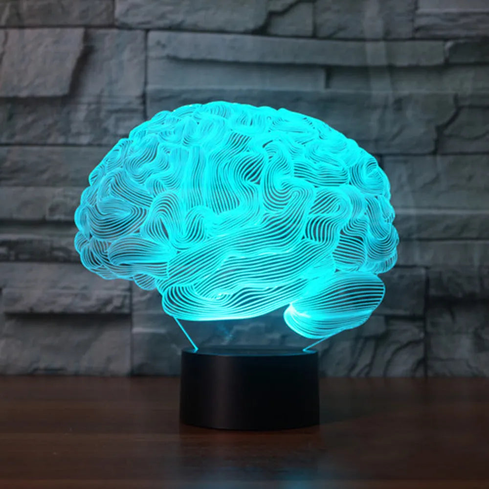 3D brain illusion desk lamp with colour-changing LED lights and remote control on wooden surface