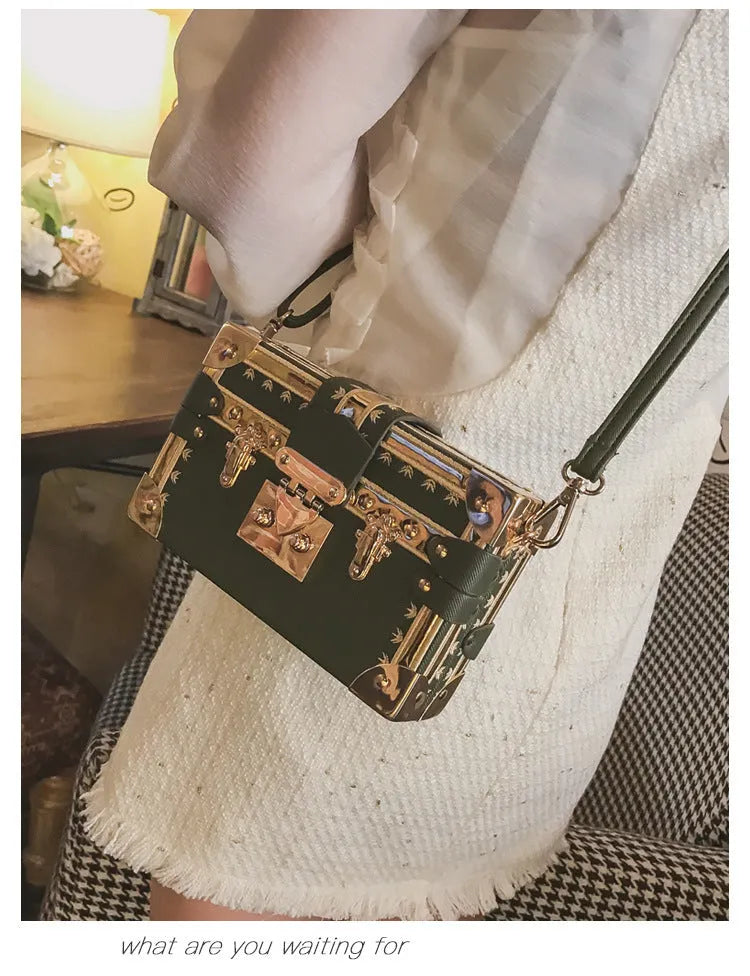 Black hard PU leather women's shoulder bag with flap, hasp closure, and rivet decoration.