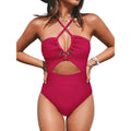Solid colour women's one-piece swimsuit with cross-back design on mannequin.