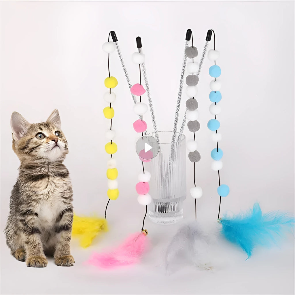 Colourful cat teaser toy rod with bell and pompon feather attachment on grey background