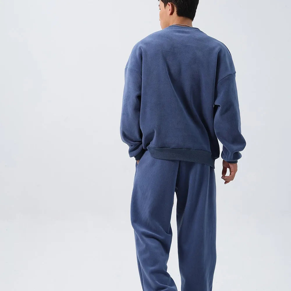 Men's loose fit polar fleece sports suit in army green, showing jacket and trousers.