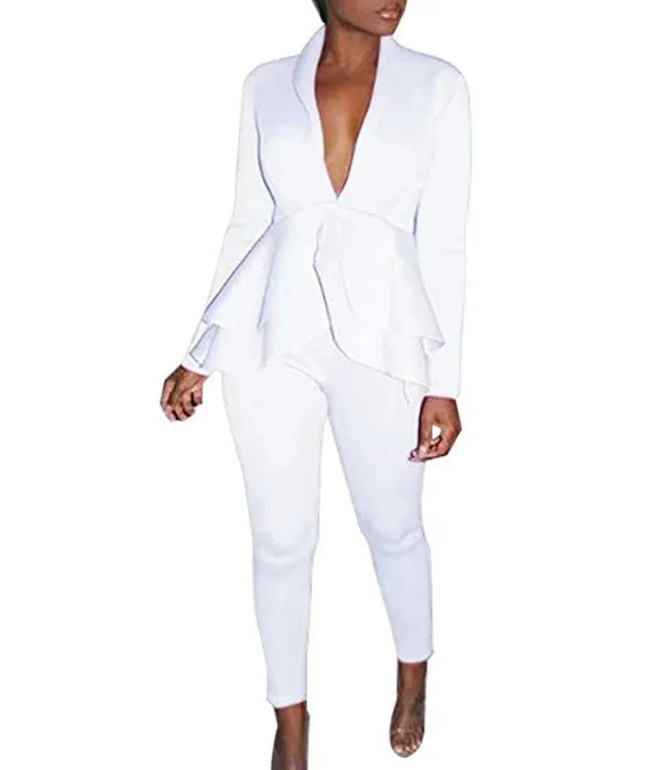White ruffled business casual shirt and matching pencil pants set laid flat.
