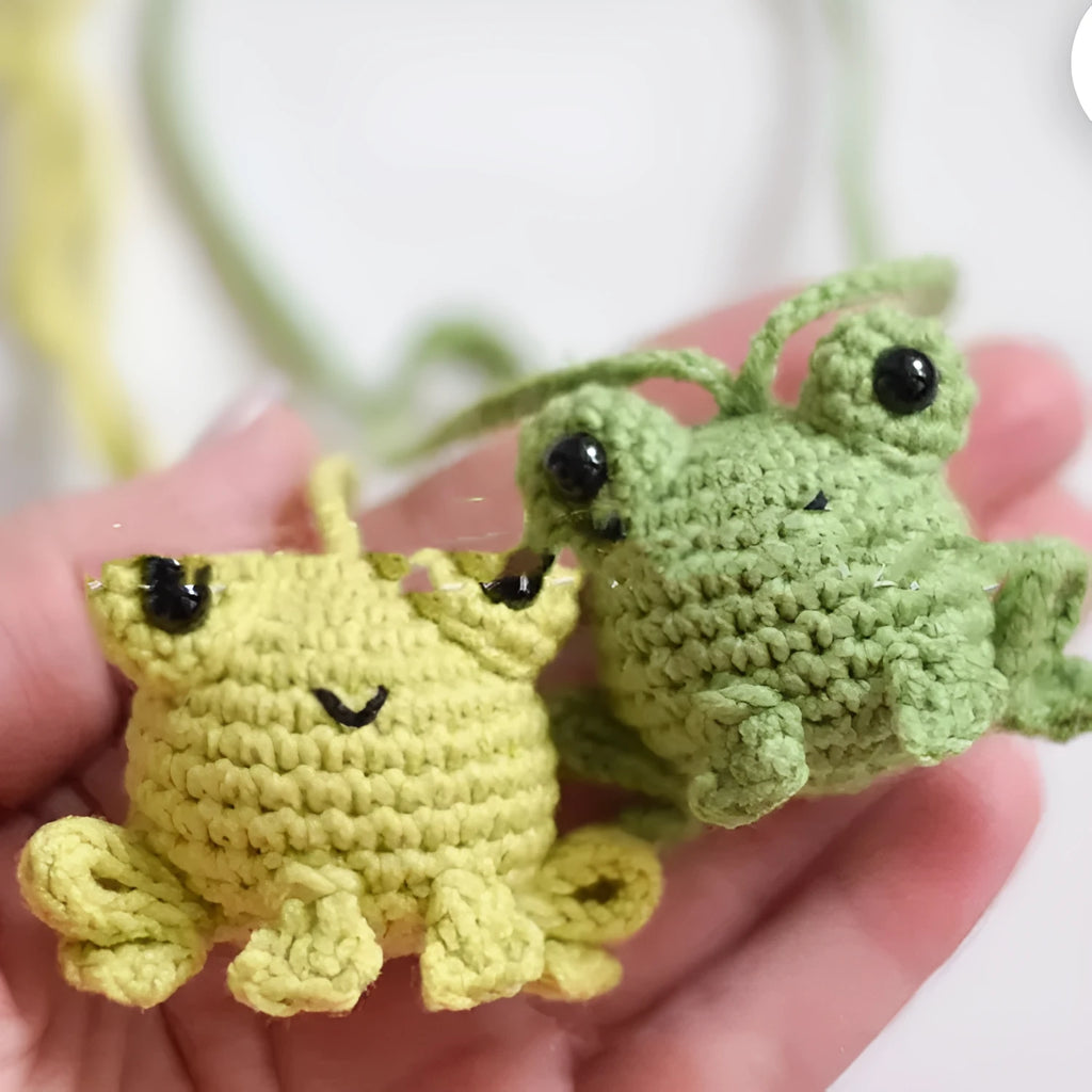 Green handmade woven plush frog car pendant hanging, showing 15cm length and cartoon style.