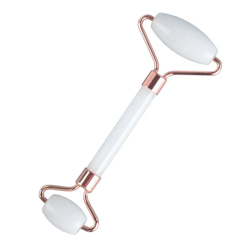 White jade dual-head facial roller and gua sha tool with a separate massage board on a plain background.