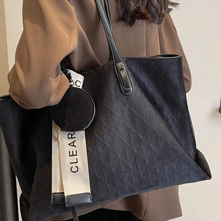 Soft green polyester large shoulder tote bag with horizontal square shape and a shoulder strap.