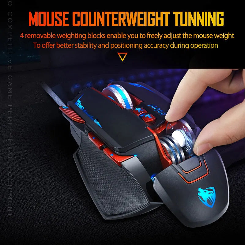Thunder Wolf V9 black wired gaming mouse with six buttons on a mousepad next to a gaming keyboard.