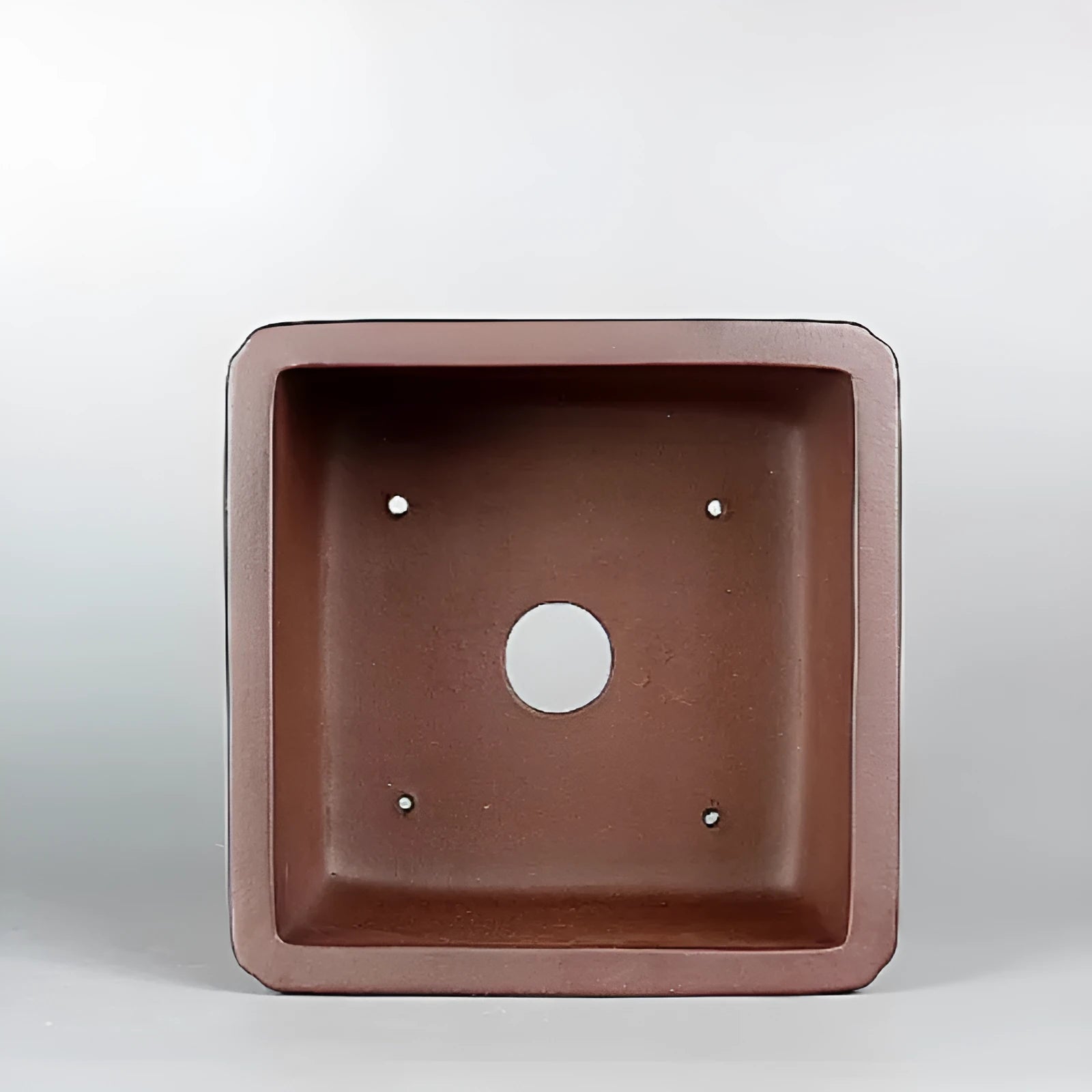 Brown handmade purple clay antique flower pot with classical design and single drainage hole