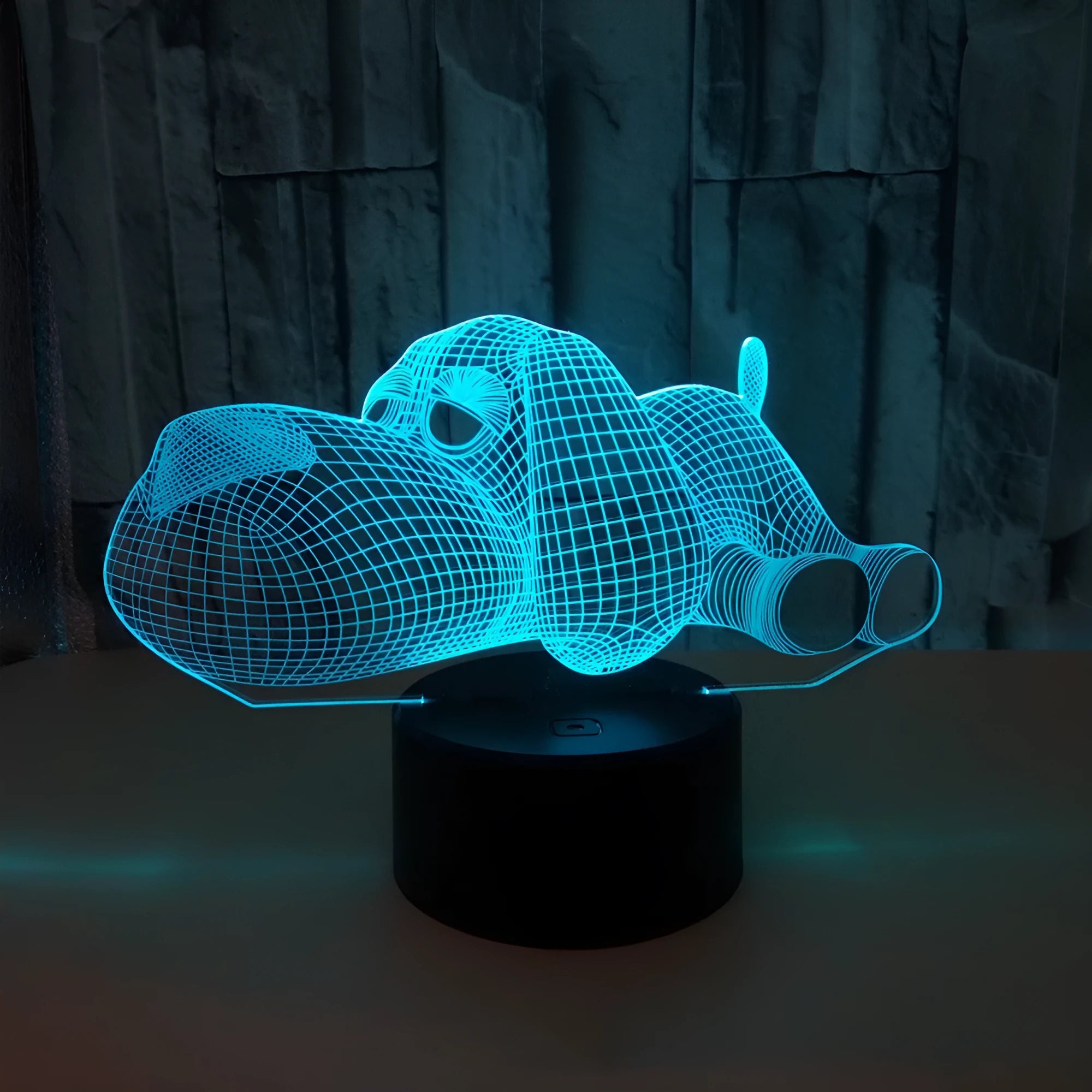 Doggo 3D illusion desktop lamp glowing in blue colour with touch button control.