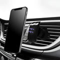 Glossy black car phone holder mounted on car air vent for smartphone securement
