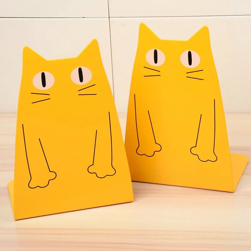 Pair of iron bookends in blue and yellow, each 14 x 20.5 x 10.5cm, on a bookshelf