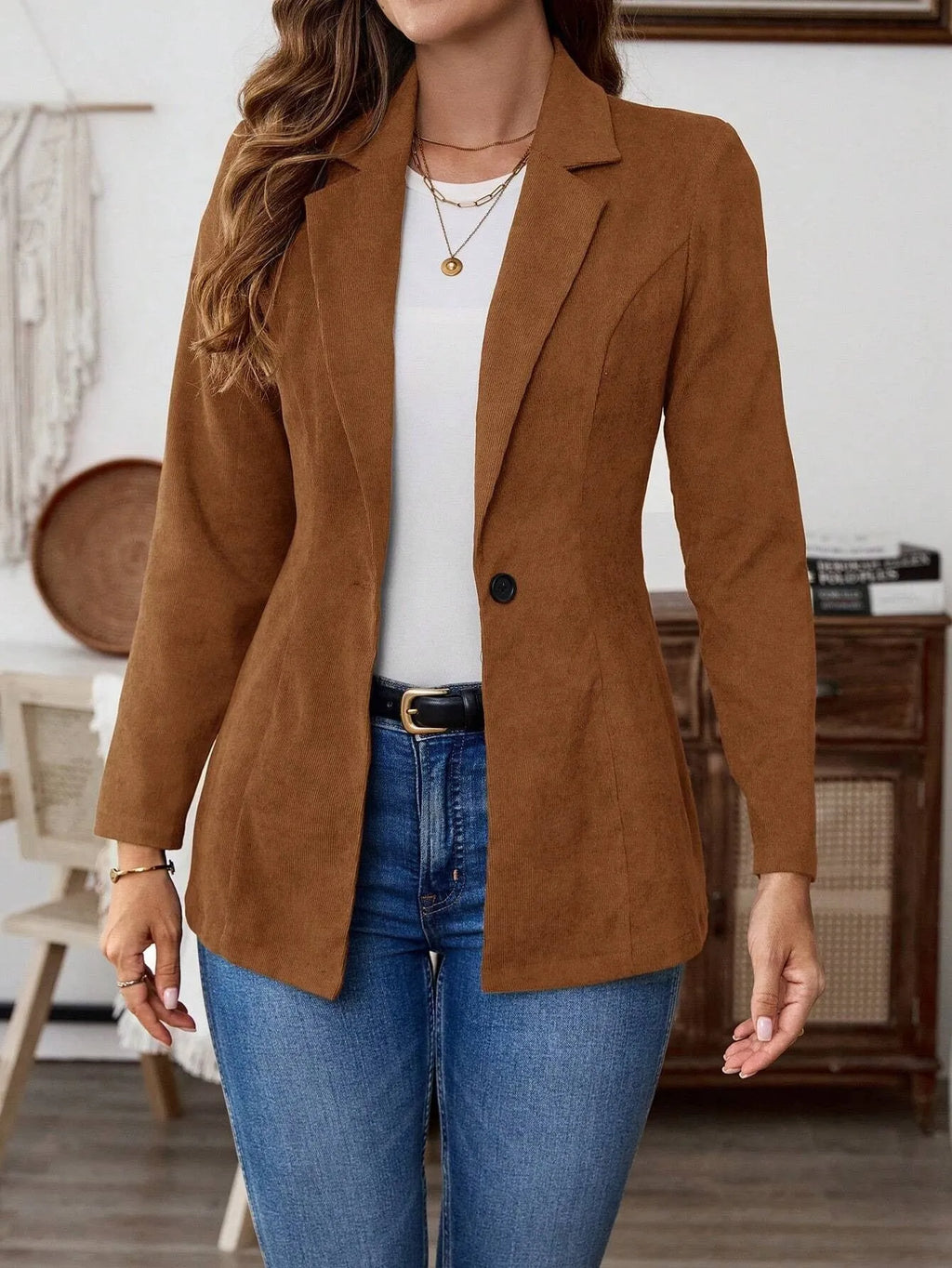 Brown men's single-breasted lapel blazer jacket on a hanger