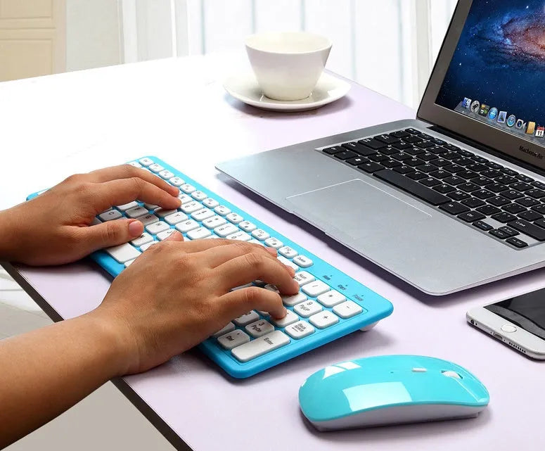 Black wireless keyboard and mouse set with 96 chocolate-style keys and a compact mouse on a desk.