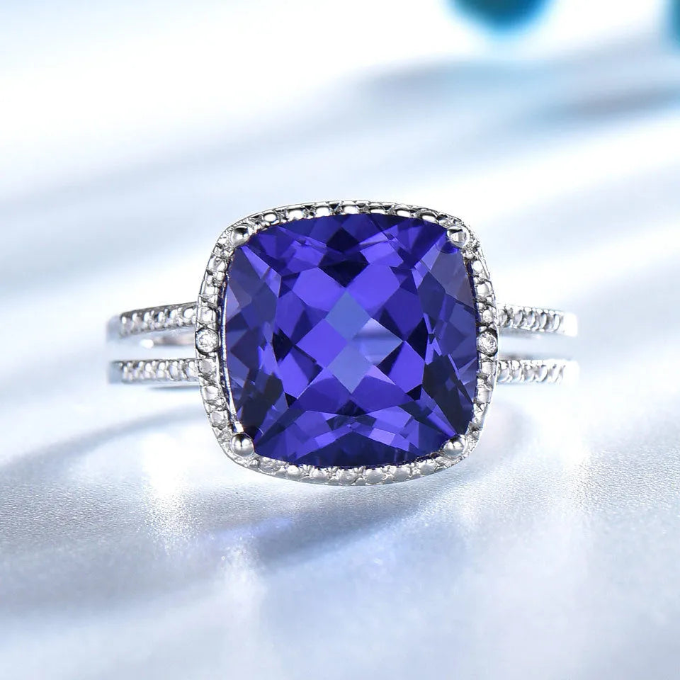 Blue tanzanite stone set in a sterling silver women's ring.