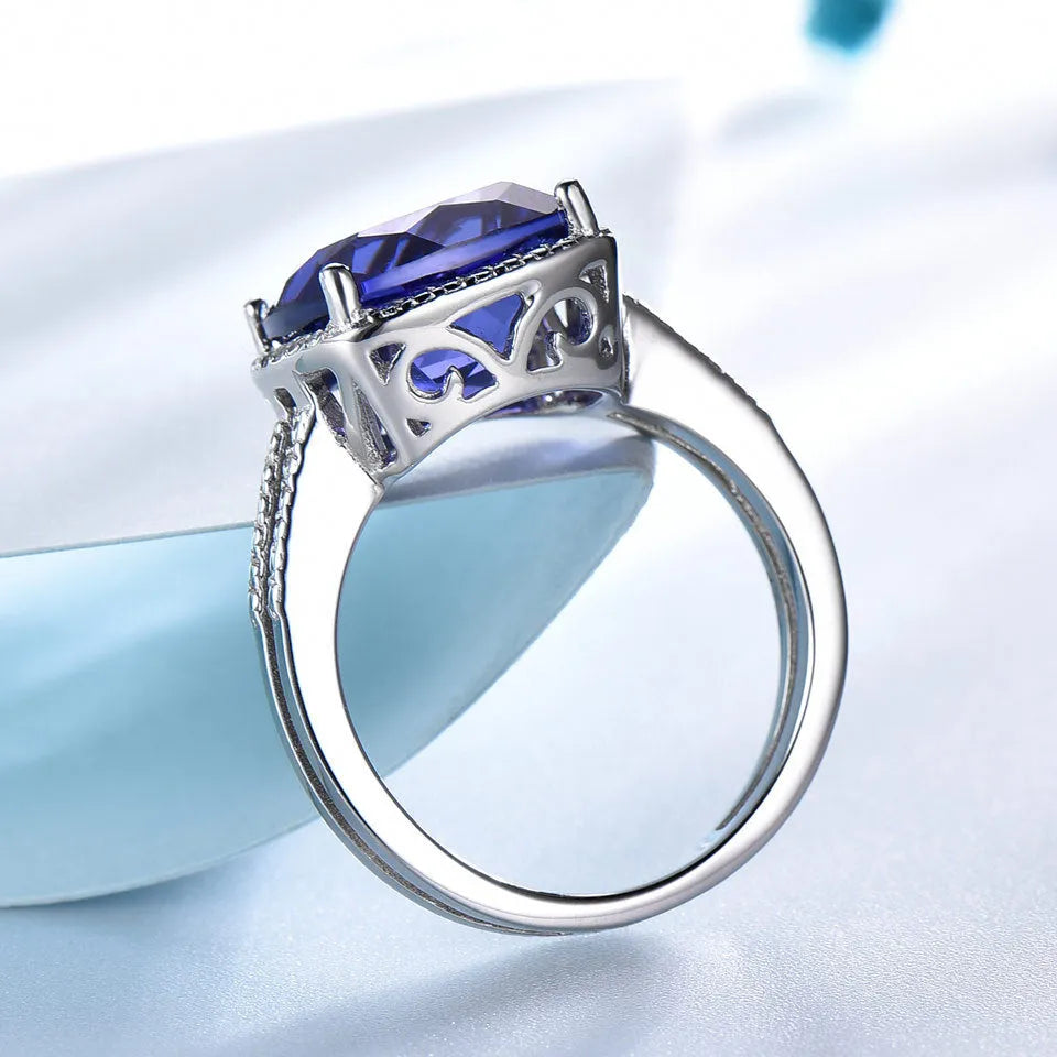 Blue tanzanite stone set in a sterling silver women's ring.