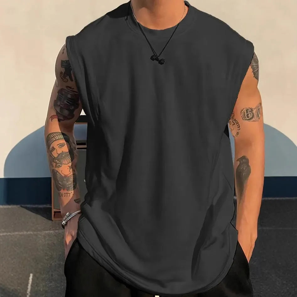Men's loose fit solid colour cotton tank top shown in apricot, available in sizes up to 5XL.