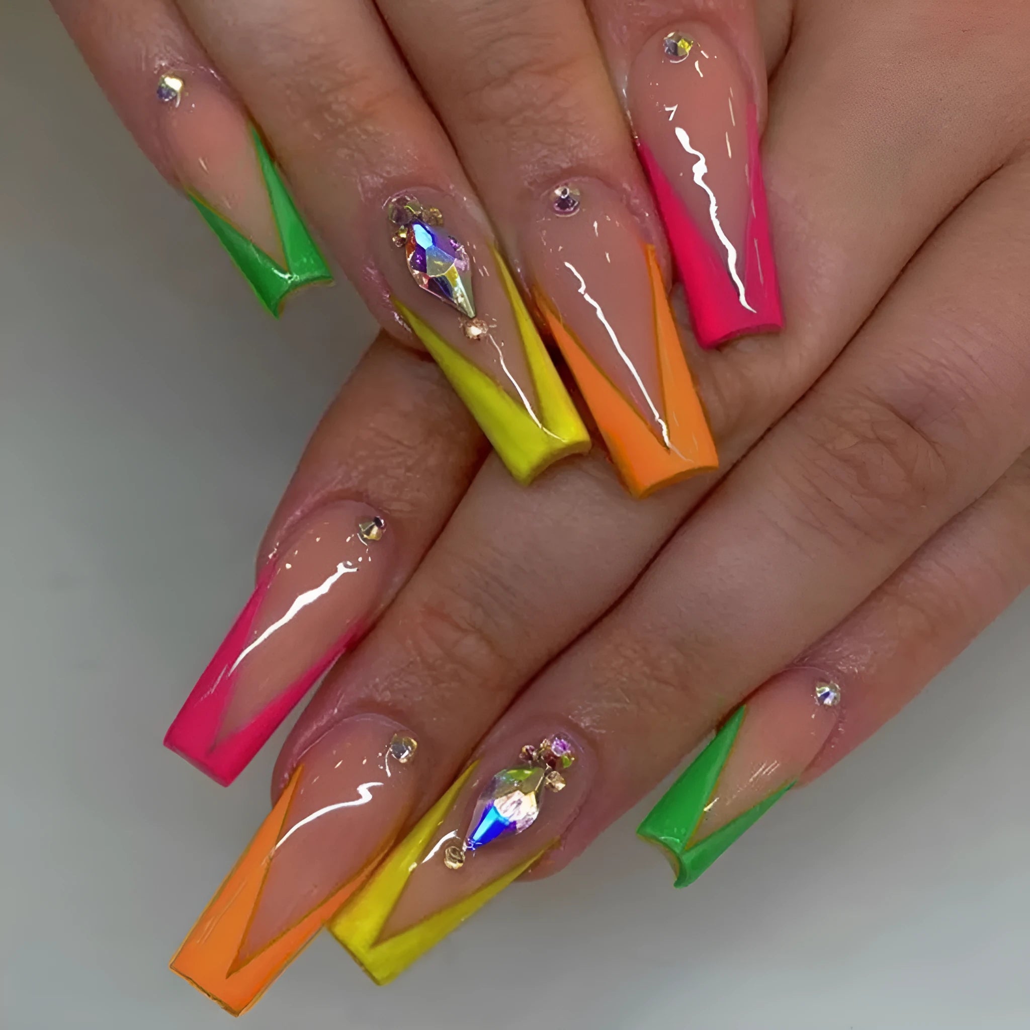 Detachable nail tips with diamond colour French finish and cartoon love heart patterns.