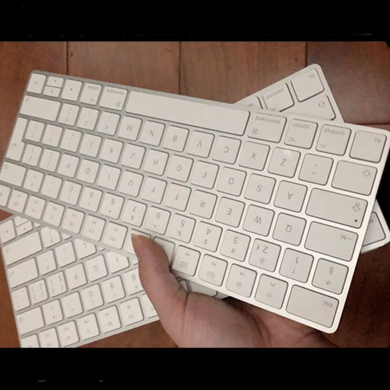White Apple Bluetooth keyboard with ultra-thin metal design and multimedia function keys