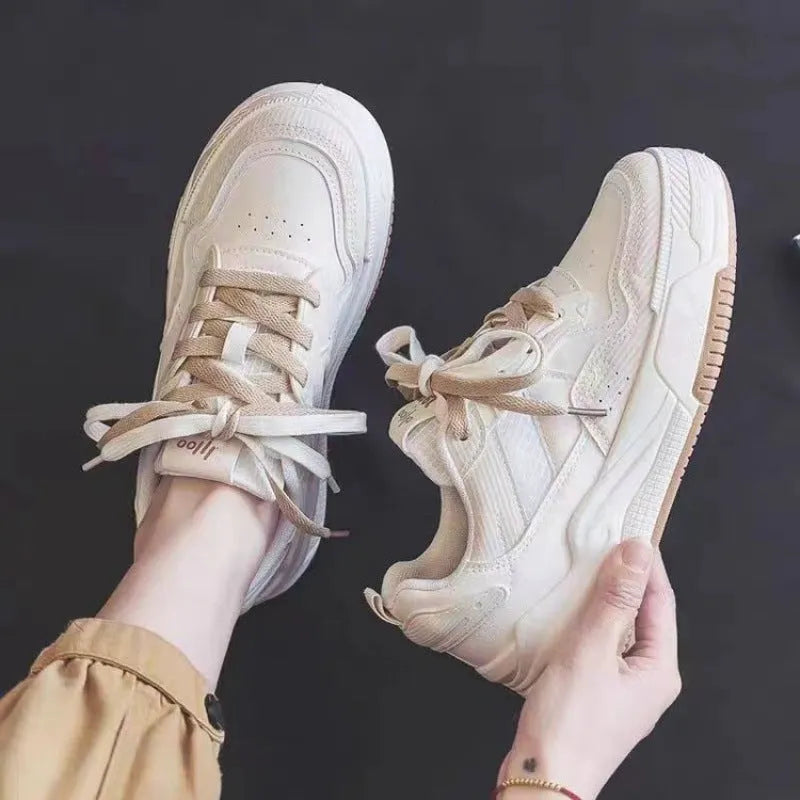 Low top sneakers with rubber sole in pink, milky white, and beige colours
