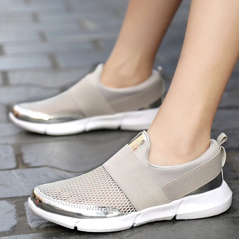 Blue, black, and grey low-top women's sneakers with breathable mesh lining and lightweight PU midsole.