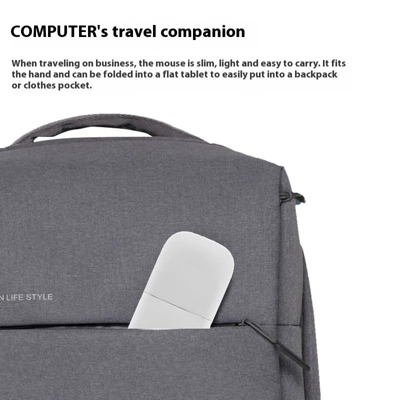 Folding Bluetooth wireless mouse shown in black, demonstrating its compact 131.2mm length and touch surface.