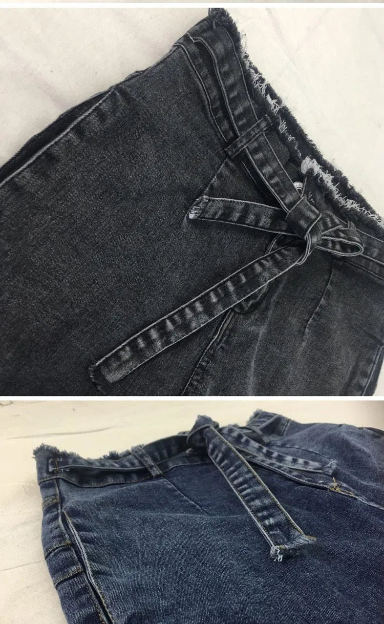 Women's fringed jeans in distressed Cowboy denim with frayed hem detailing in grey, dark blue, or light blue