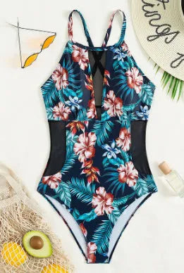 Women's printed one-piece swimsuit with deep V neckline on a mannequin, showing gradient colour design.