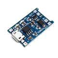 Blue lithium battery charging and protection circuit board measuring 2.6cm by 1.7cm