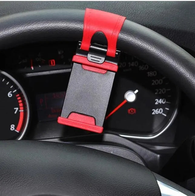 Universal black steering wheel phone mount holder clipped onto a car wheel