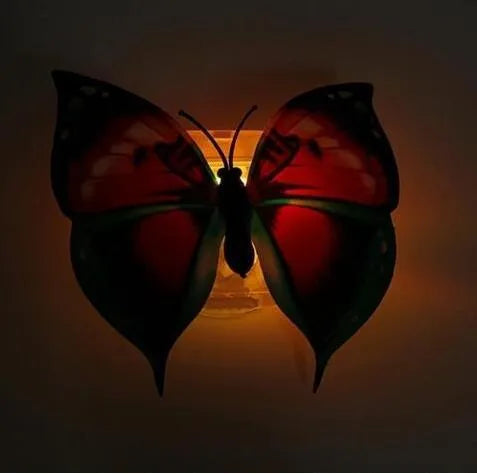 12 butterfly LED night lights with auto-change colours and suction pad on a surface