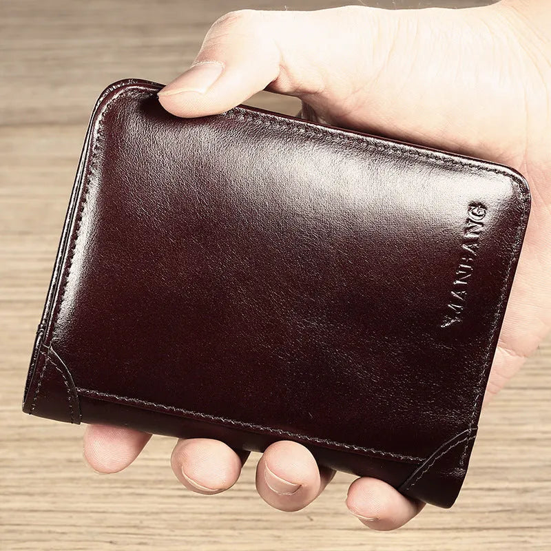 Men's black leather wallet open showing internal card slots, note compartment, and change section.