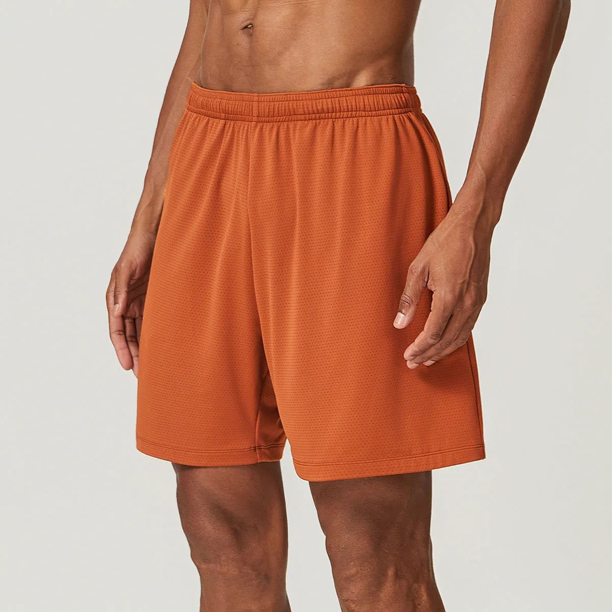 Men's sky green quick-drying running shorts with mid-waist design on a plain background.