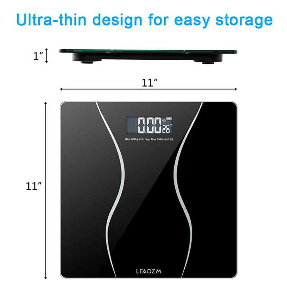 Black electronic digital bathroom scale with LCD display on a bathroom floor.