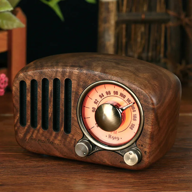 Retro wooden wireless mini speaker in cherry wood or walnut finish, showing compact size
