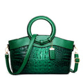 Fabric women's handbag showing multiple zipper compartments and organisational pockets